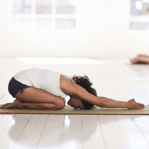 Yogini in Child's Pose